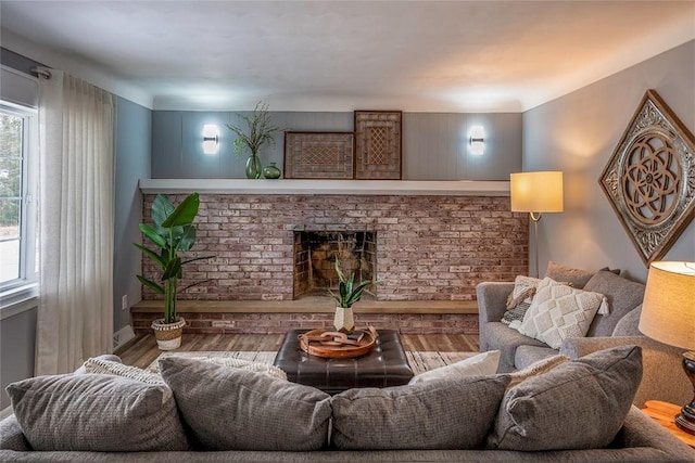 living room with hardwood / wood-style floors and a fireplace