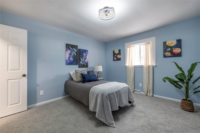 bedroom with light colored carpet