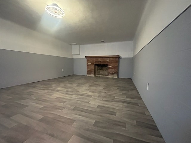 unfurnished living room with a fireplace and hardwood / wood-style floors