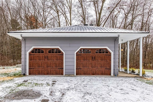 view of snow covered garage