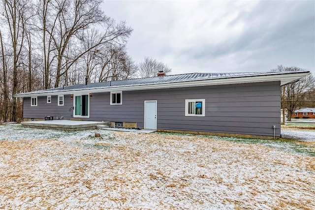 back of property with a patio area