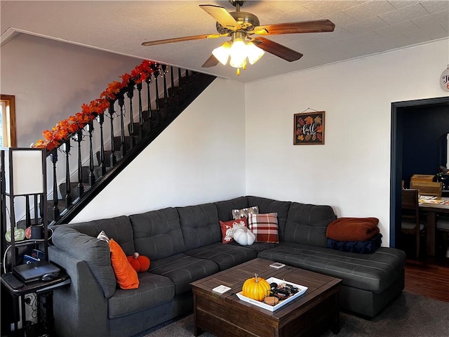 living room with carpet floors and ceiling fan