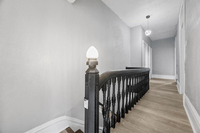 stairway featuring hardwood / wood-style floors