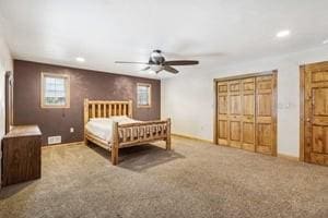 bedroom with ceiling fan and carpet floors