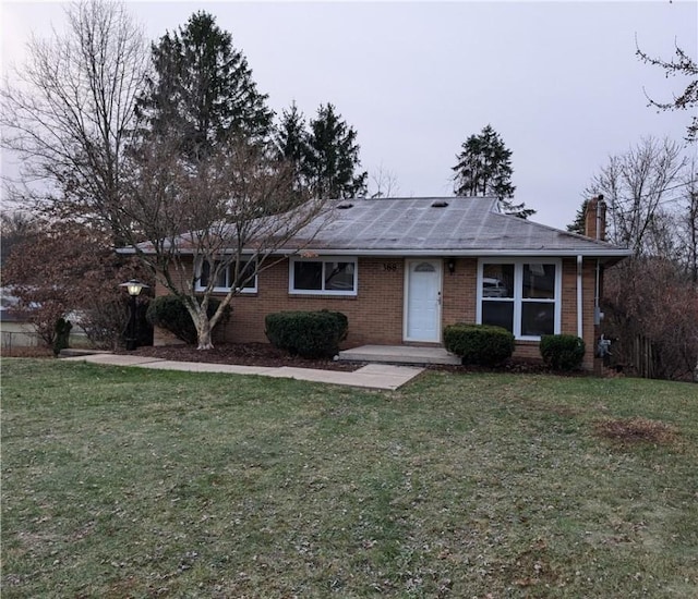 ranch-style house featuring a front lawn