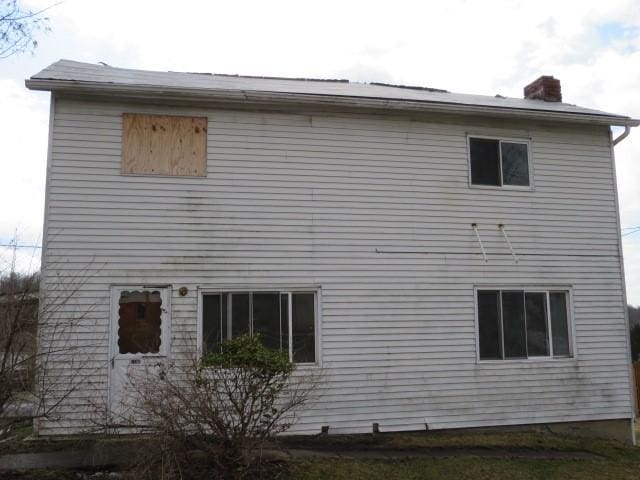 view of home's exterior with a chimney