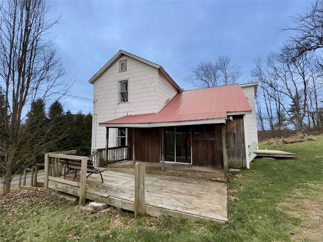 back of house with a yard and a deck