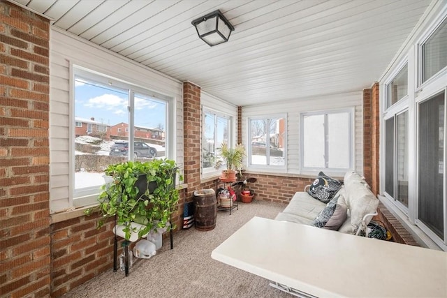 sunroom / solarium featuring plenty of natural light