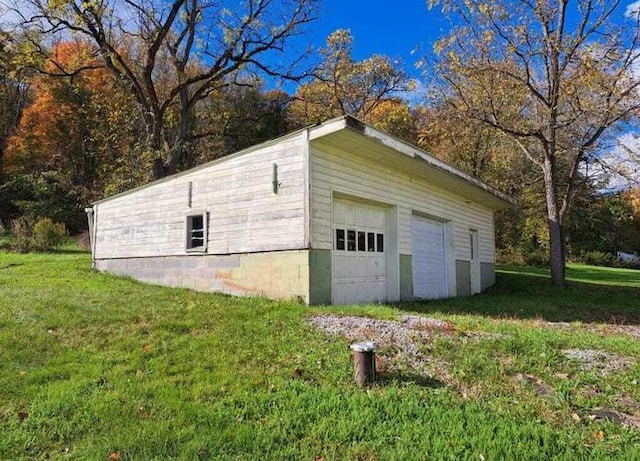 garage featuring a yard