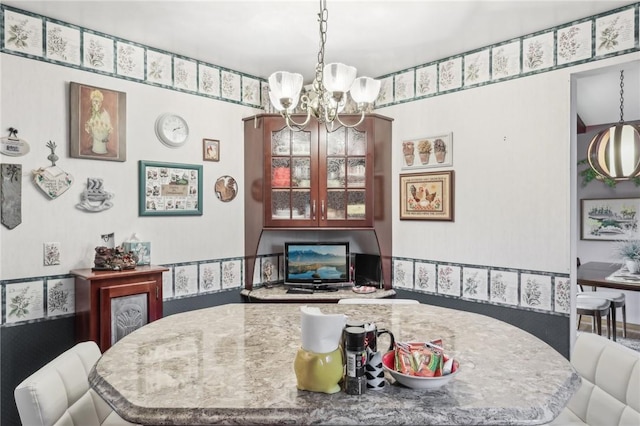 dining area featuring a chandelier