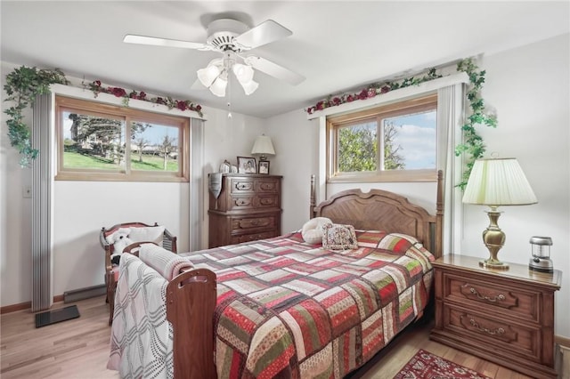 bedroom with ceiling fan and light hardwood / wood-style flooring