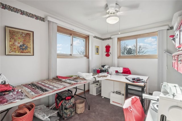 carpeted bedroom with multiple windows and ceiling fan