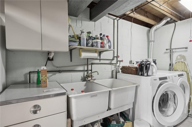 laundry area with cabinets and independent washer and dryer