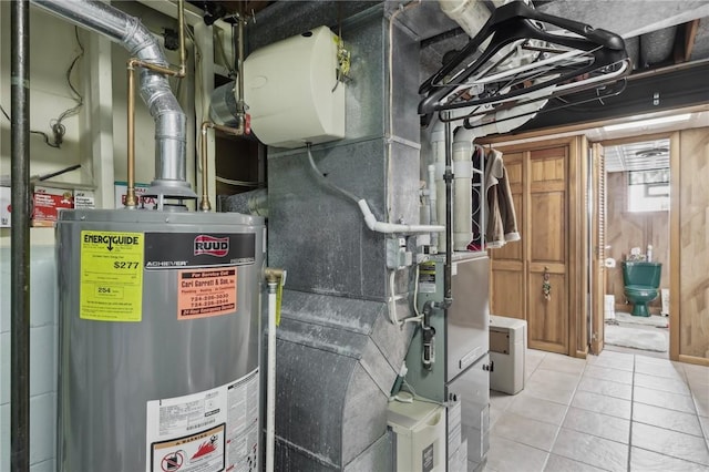 utility room featuring water heater