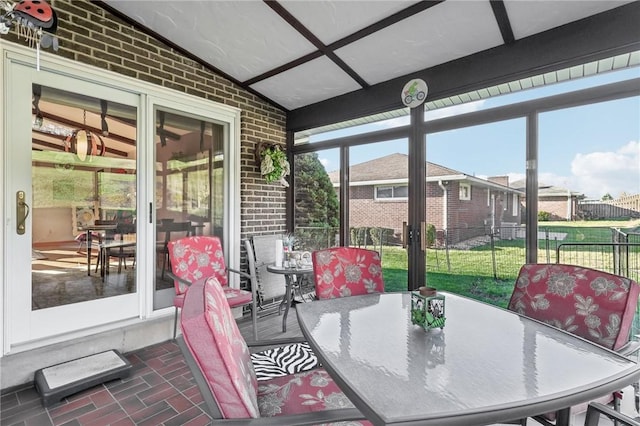 sunroom with vaulted ceiling