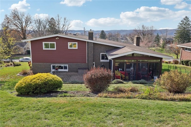 view of property exterior with a mountain view and a lawn