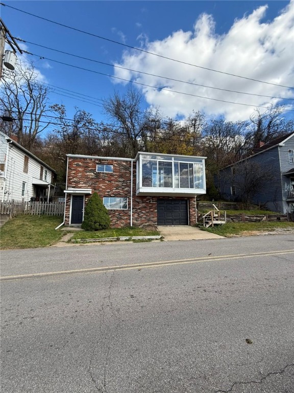 view of front of home featuring a garage