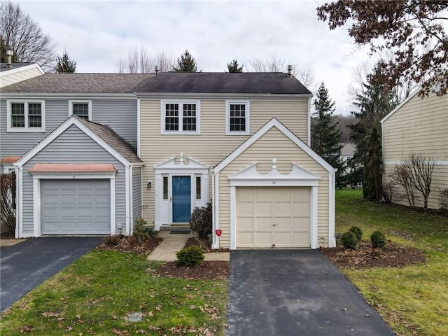 view of front of home featuring a garage and a front yard