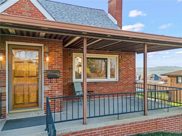 entrance to property featuring a porch