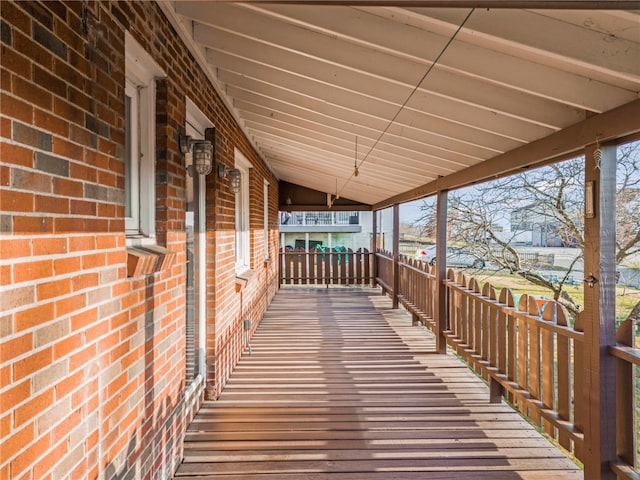 wooden terrace with a porch