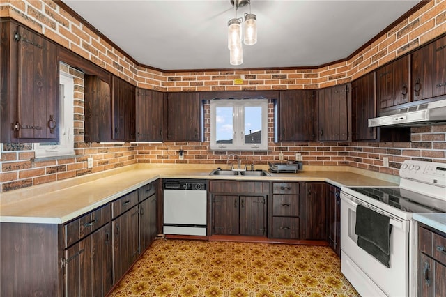 kitchen featuring dark brown cabinets, white appliances, and sink