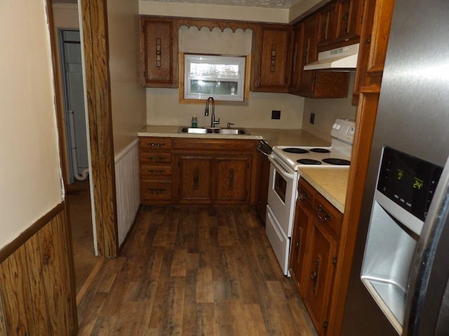 kitchen featuring white range with electric stovetop, sink, dark hardwood / wood-style floors, and stainless steel refrigerator with ice dispenser