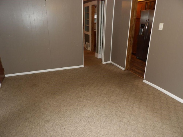 spare room featuring carpet floors