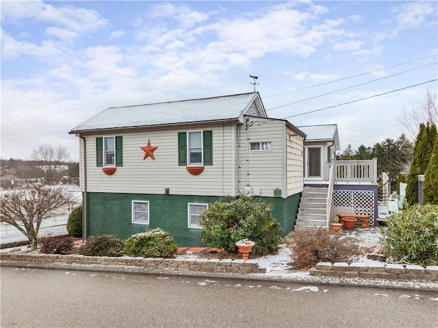 view of front of house with a wooden deck