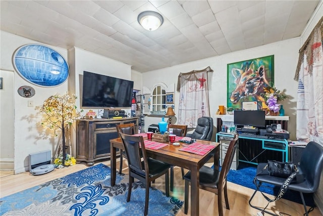 dining area with hardwood / wood-style floors