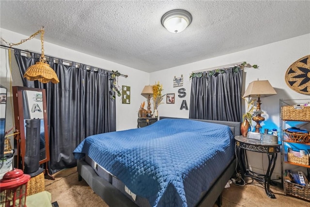 bedroom featuring light carpet and a textured ceiling