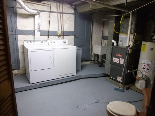 basement with independent washer and dryer and gas water heater