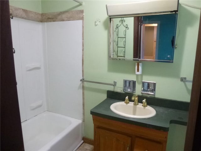 bathroom with vanity and bathtub / shower combination