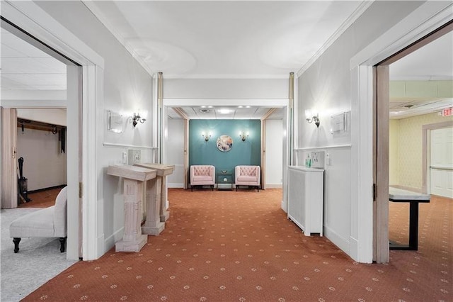 hall featuring carpet and ornamental molding