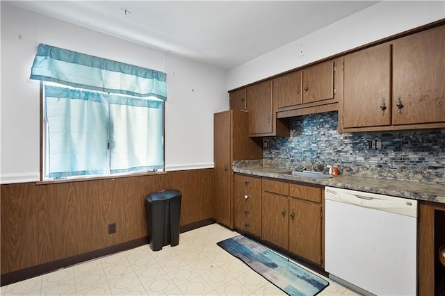 kitchen with dishwasher, tasteful backsplash, and sink