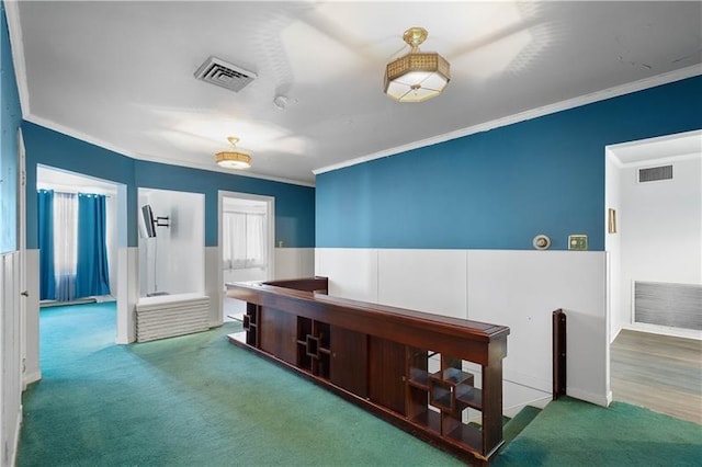 corridor with carpet and crown molding