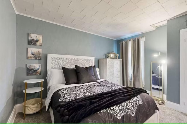 bedroom featuring carpet flooring and crown molding