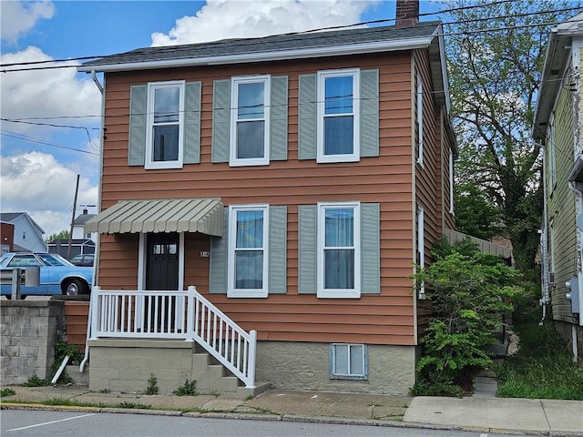 view of front of property with a chimney