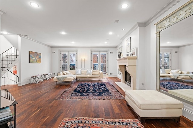 living room with french doors, ornamental molding, and dark wood-type flooring