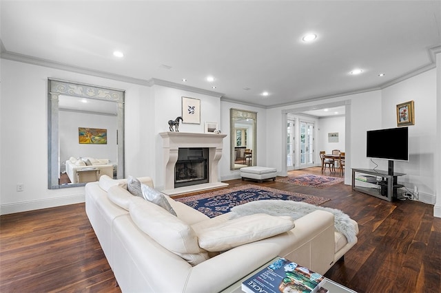 living room featuring dark hardwood / wood-style floors and crown molding