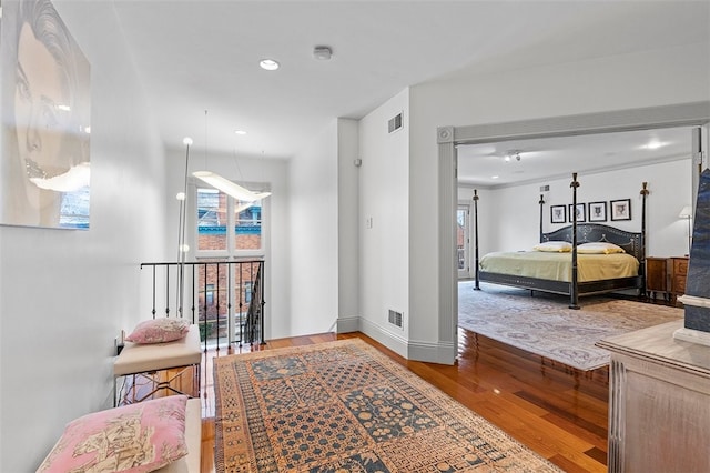 bedroom with hardwood / wood-style flooring