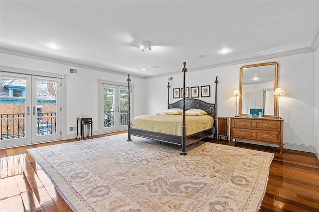 bedroom featuring access to exterior, french doors, ornamental molding, and hardwood / wood-style flooring