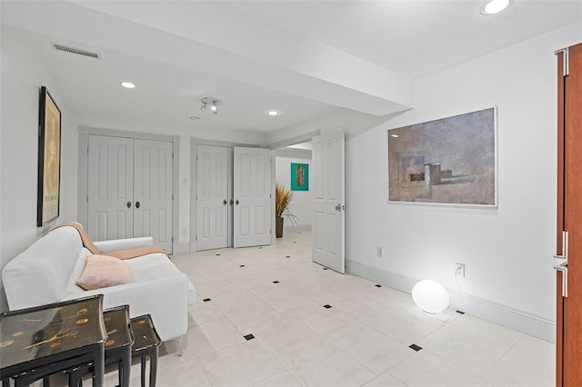 living area featuring light tile patterned floors