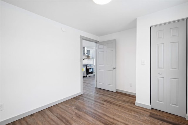 empty room with dark wood-type flooring