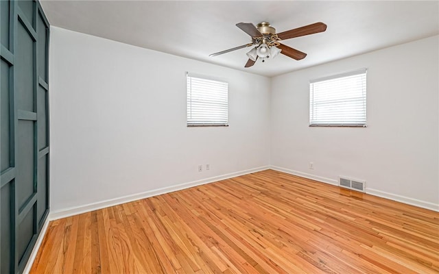 unfurnished room featuring ceiling fan and light wood-type flooring