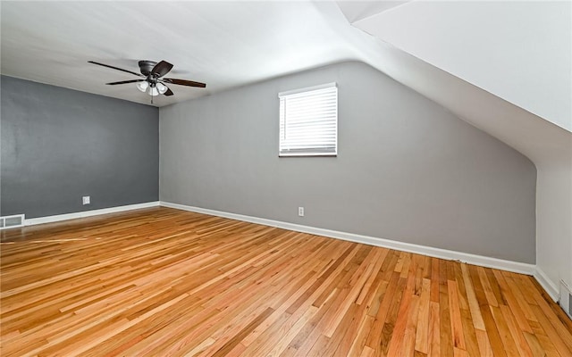 bonus room featuring ceiling fan, light hardwood / wood-style flooring, and vaulted ceiling