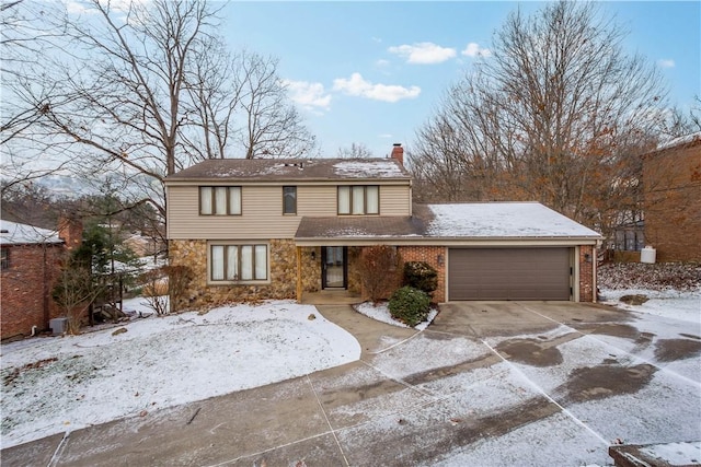 view of front of home with a garage, concrete driveway, stone siding, a chimney, and brick siding