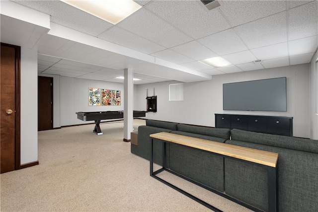 carpeted living room with a drop ceiling and billiards