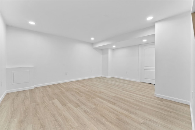 spare room featuring light hardwood / wood-style floors