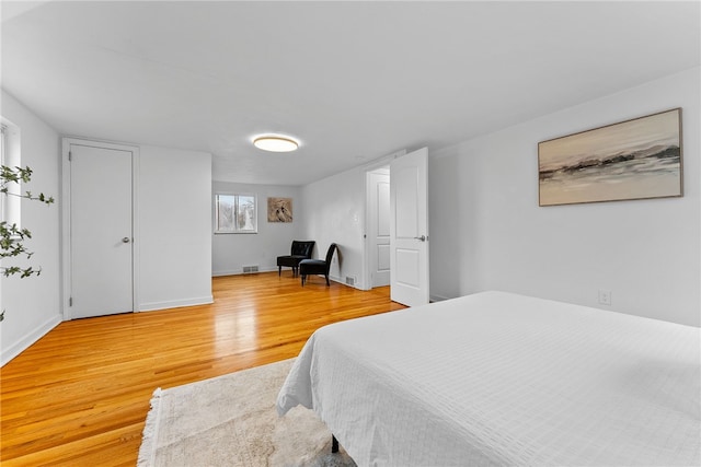 bedroom featuring wood-type flooring