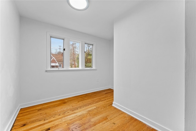 empty room with light hardwood / wood-style floors